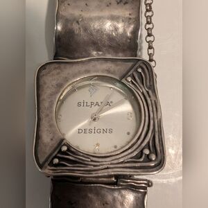 A retired Silpada sterling silver hammered square link watch. 